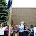 Sixth grade language arts teacher Joel Osborn raises the American and Michigan Flags during the last day of school at Estabrook Elementary on Friday, June 7. Daniel Brenner I AnnArbor.com